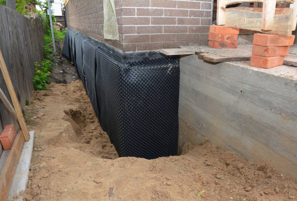 Happy homeowners after waterproofing job in Duluth